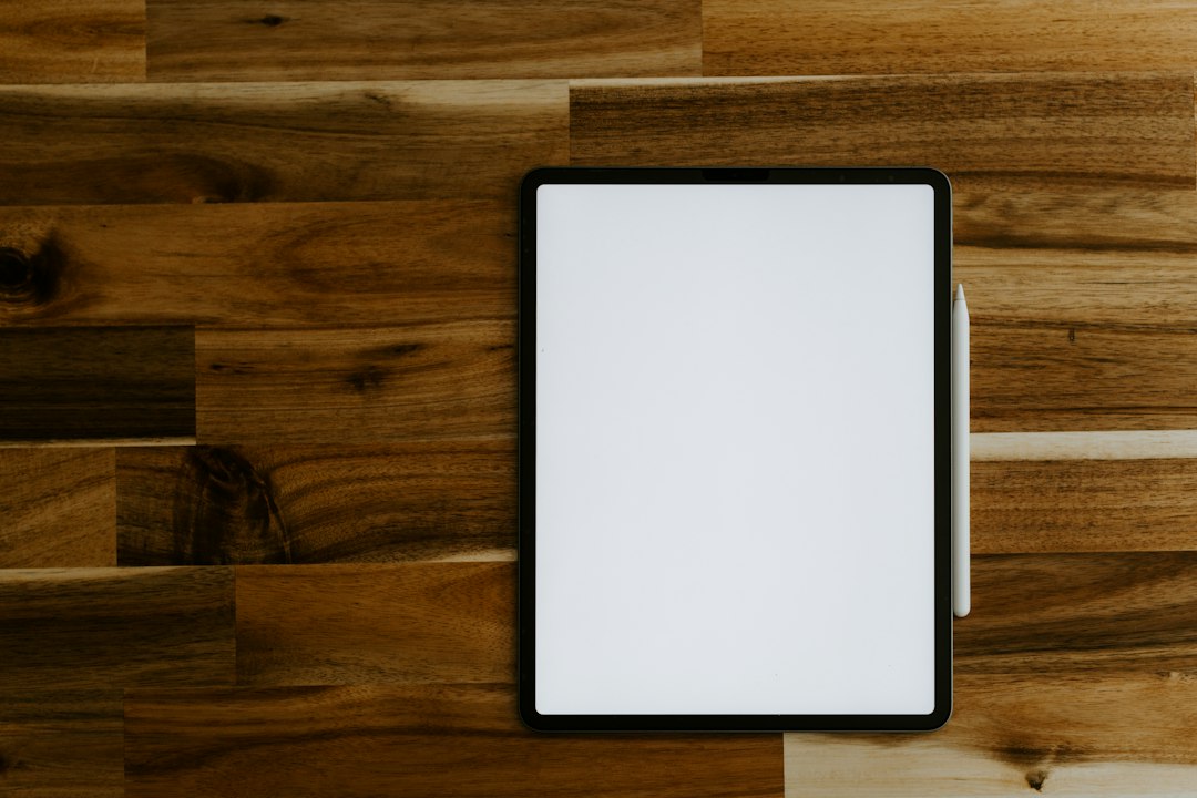 iPad Pro with Apple Pencil on a wooden table – iPad rental in Dubai