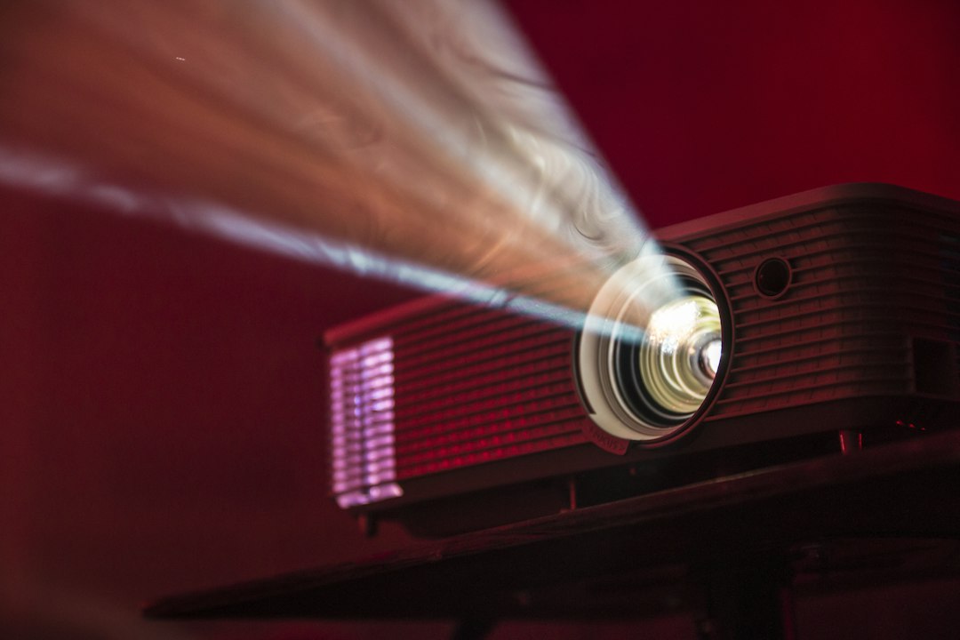 Projector beaming light for a presentation – projector and printer rental in Dubai